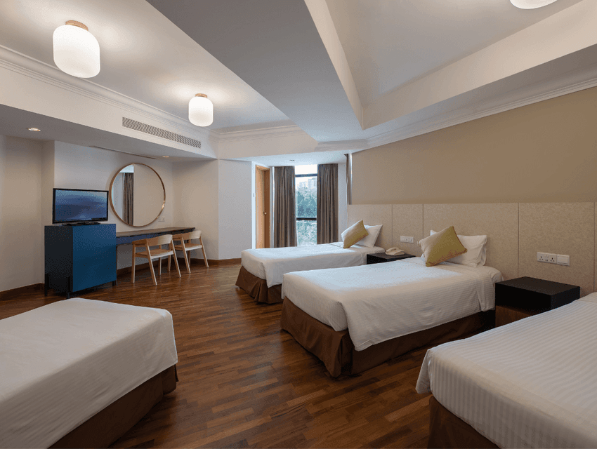 Quad Room featuring TV lounge and workspace with city view at YWCA Fort Canning Lodge