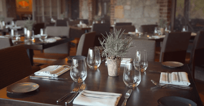 Table arrangements in a dining hall at The Abbey Inn