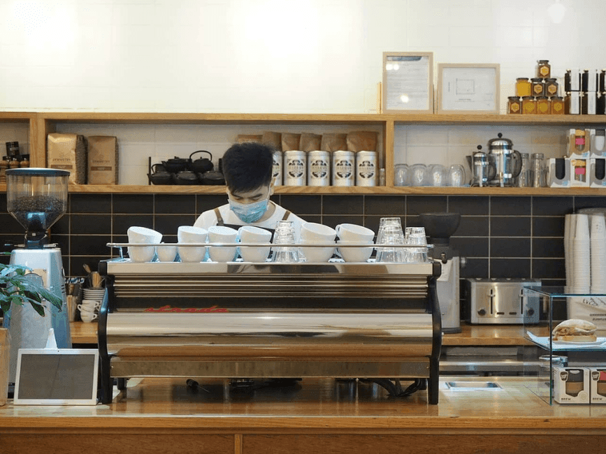 Barista by the counter in Cherry & Twigs at Brady Apartment Hotel Flinders Street