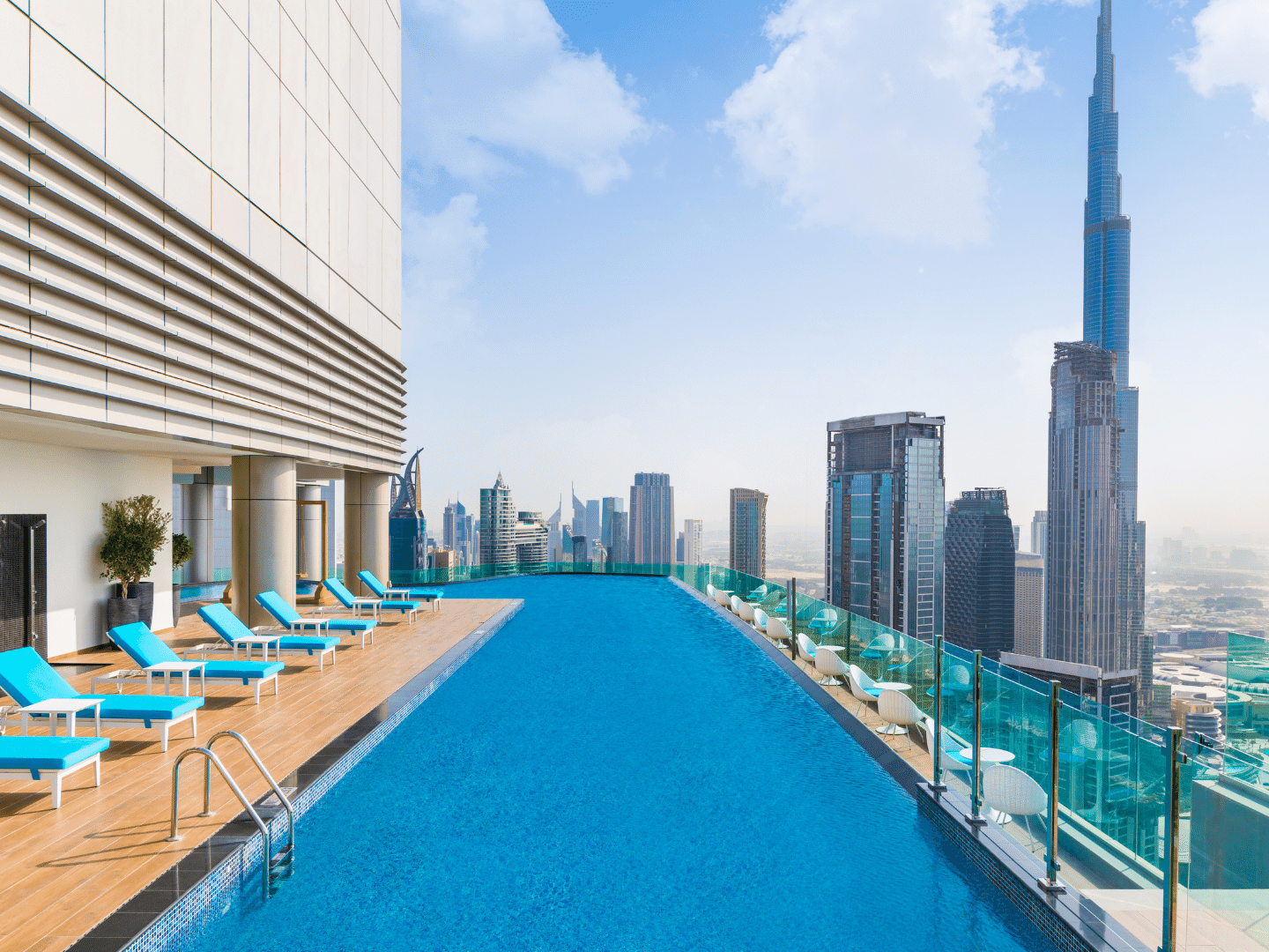 Sun loungers by the pool with city view in Malibu Sky Lounge & Bar at Paramount Hotel Midtown