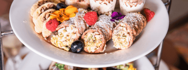 Tiered dessert display, an array of delicious treats served in the Deli Café & Market at Novotel Sunshine Coast Resort