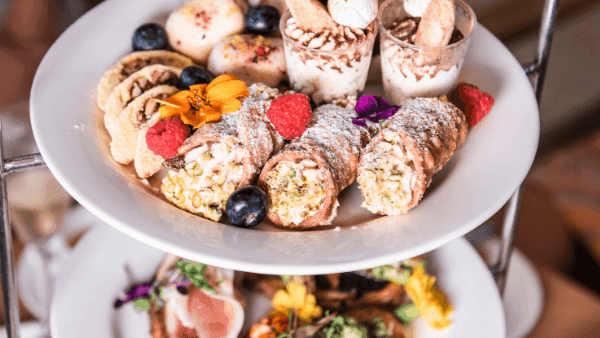 Tiered dessert display, an array of delicious treats served in the Deli Café & Market at Novotel Sunshine Coast Resort