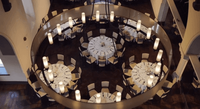 Banquet hall through a higher lampshade at The Abbey Inn