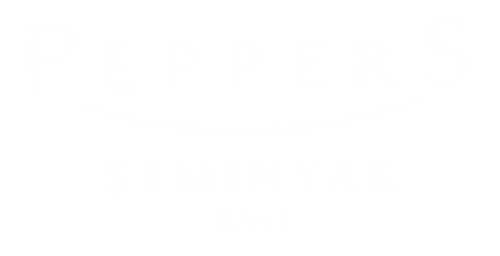 White logo of Peppers Seminyak 