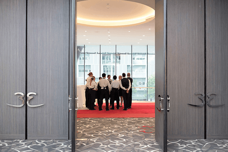 Hotel crew gathered for a meeting at Emporium Hotels South Bank