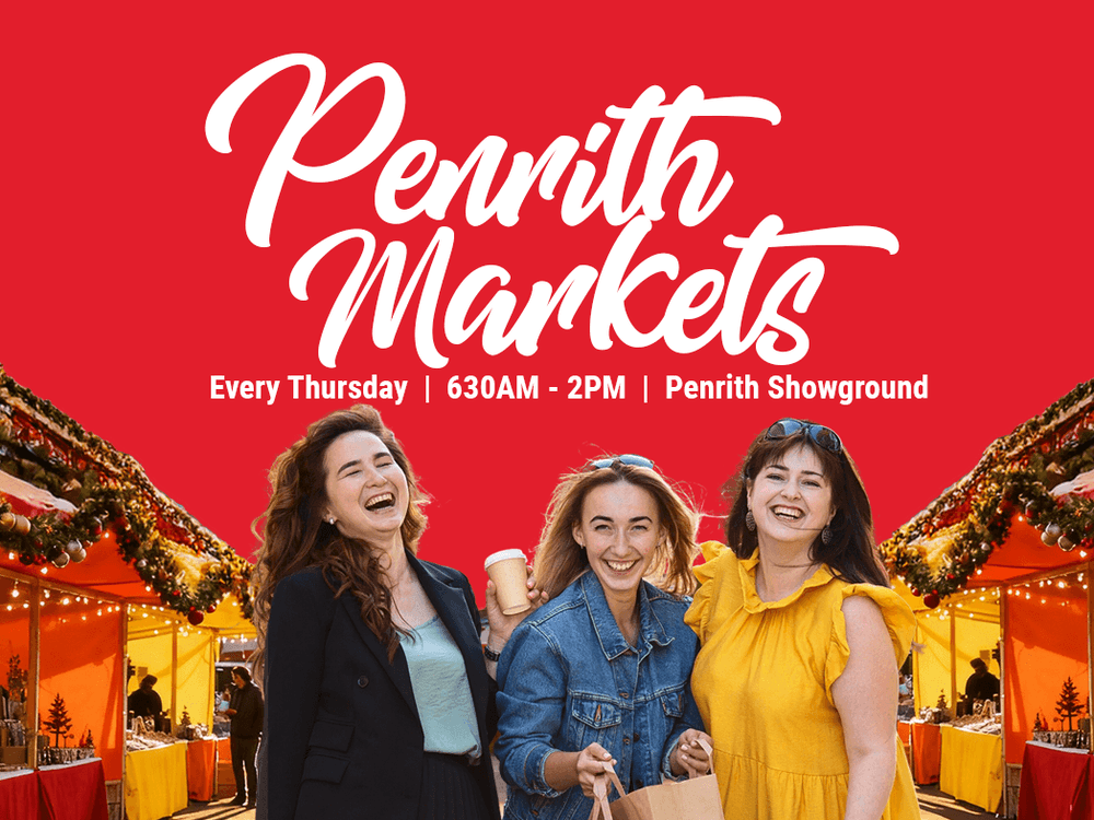 Three smiling women with a cup and shopping bag at Penrith Markets.