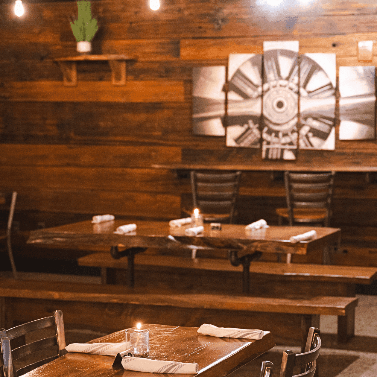 Spacious dining area and bar seating inside The Tap House restaurant