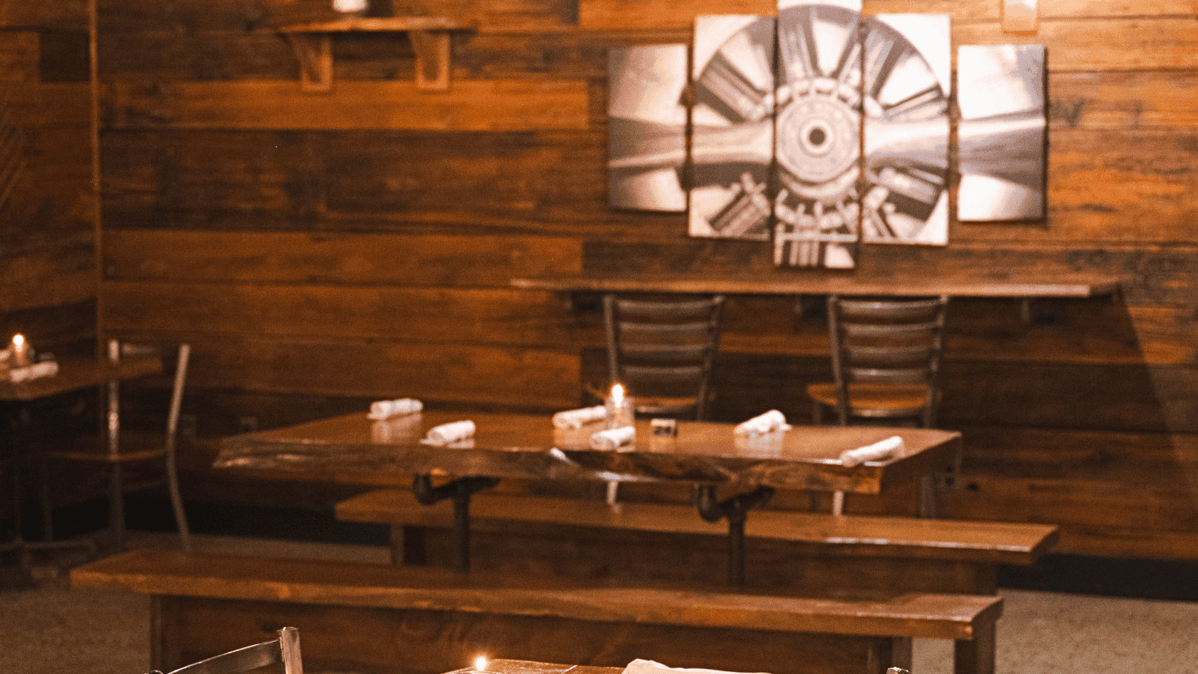 Spacious dining area and bar seating inside The Tap House restaurant