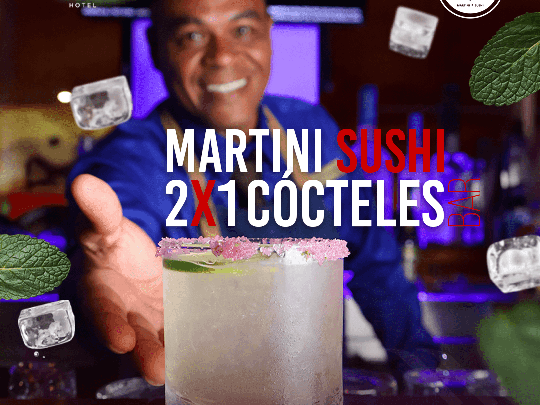 Smiling bartender behind a cocktail glass with 