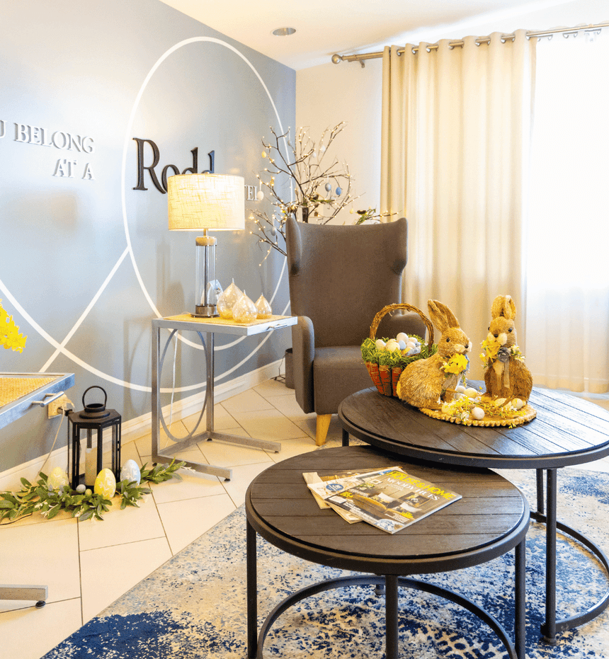 Cozy lobby seating area with armchair and coffee tables, a great choice for places to stay in Moncton at Rodd Moncton