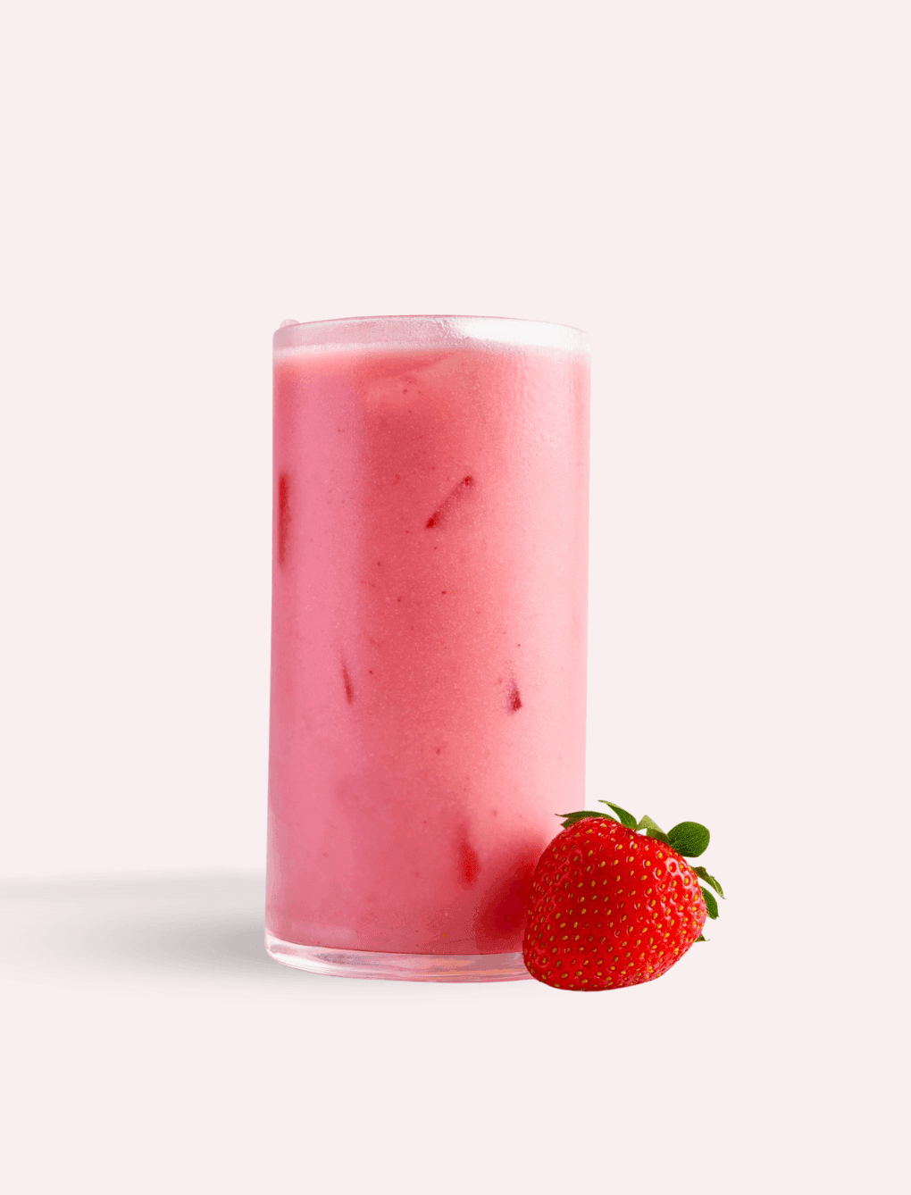 Strawberry milkshake served with a strawberry at The Londoner Hotel in a refreshing setup