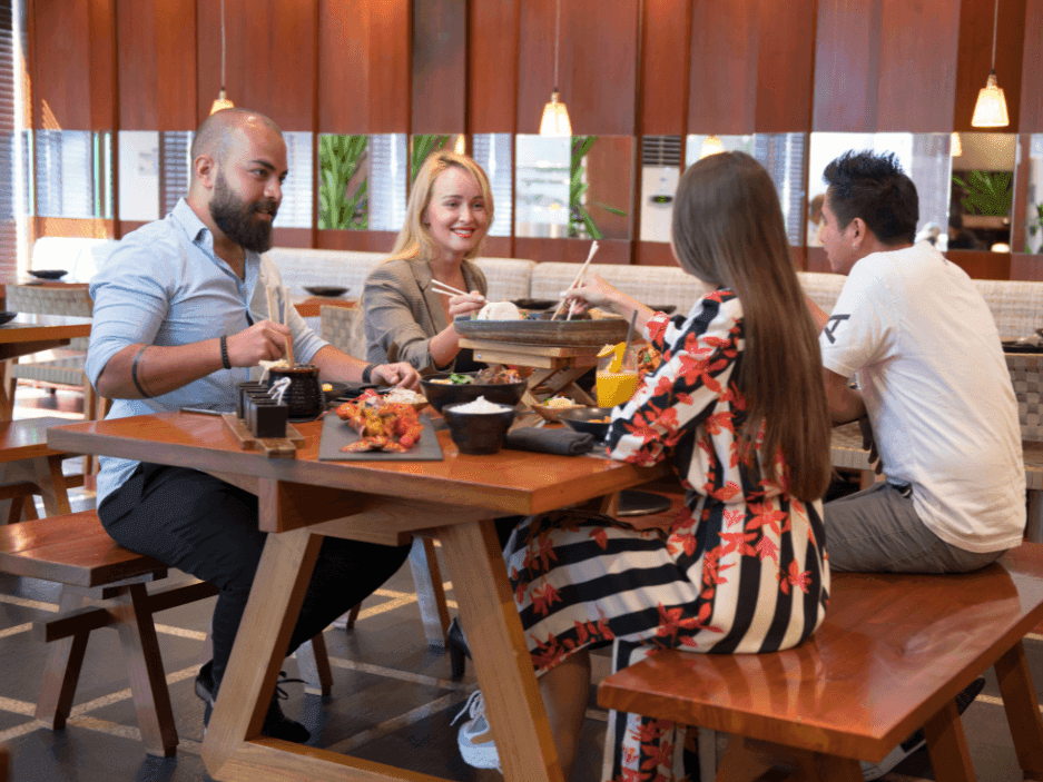 Couples dining in House Of Noodles at Two Seasons Hotel & Apt