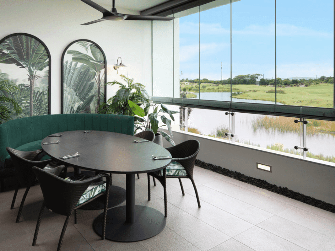 Dining set-up in Barretts Restaurant overlooking the golf course at Pullman Magenta Shores