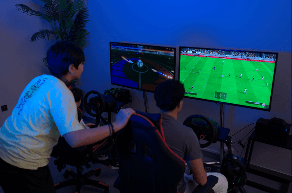 Players immersed in thrilling gaming sessions with football in Level Up - Indoor Gaming Hub at DAMAC Maison Aykon City