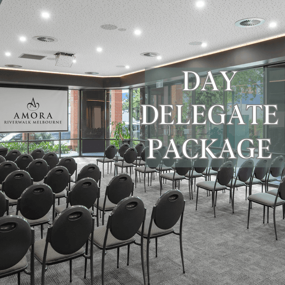 Chairs arranged with a screen in a meeting room at Amora Hotel Riverwalk Melbourne