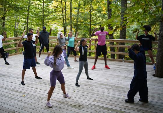 People engaged in Healing Qigong in a park near Honor's Haven Retreat