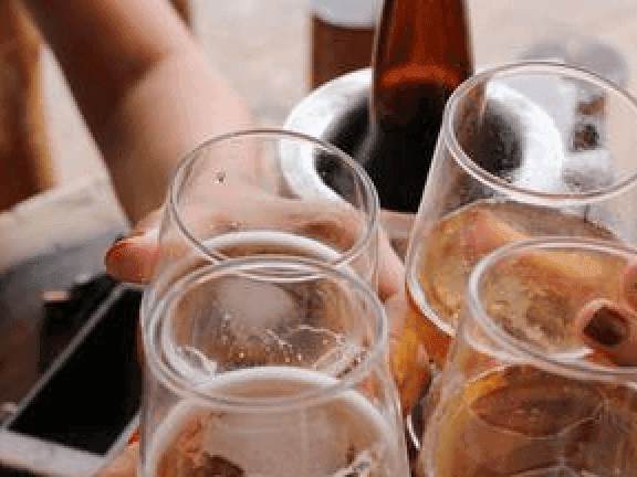 A group of people having a toast - Monte Carlo Inns Oakville Suites