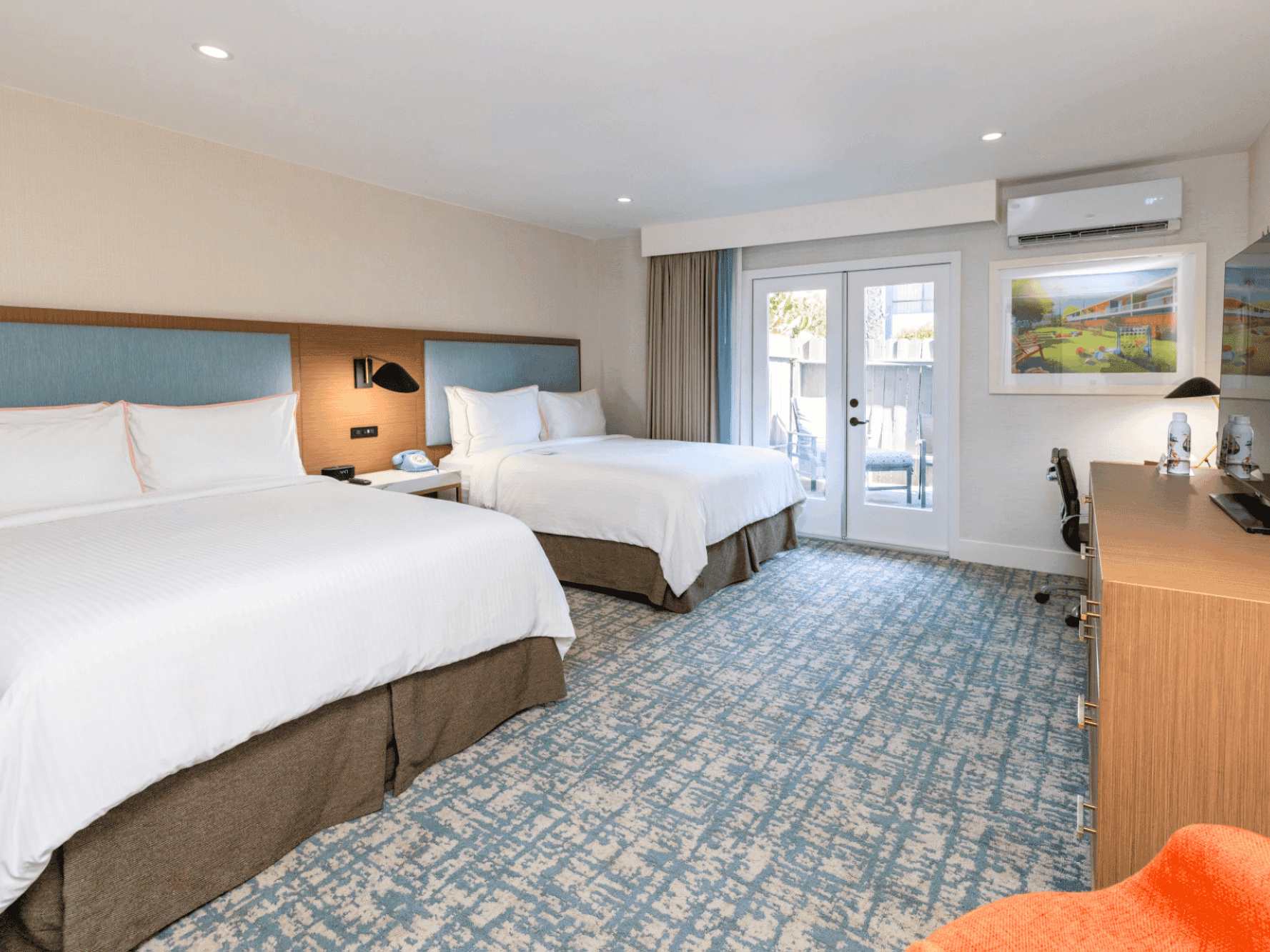 Premier Queen bedroom with french doors, A/C unit, TV and TV stand
