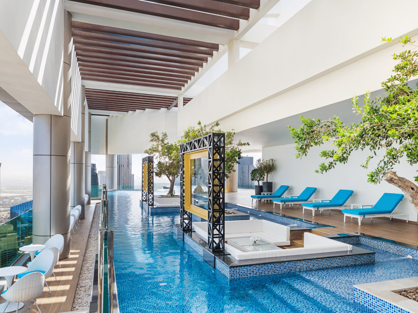 Loungers by the indoor pool in Malibu Sky Lounge & Bar at Paramount Hotel Midtown