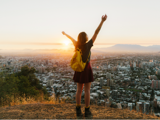 Girl watching the city on a cliff at Hotel Plaza San Francisco