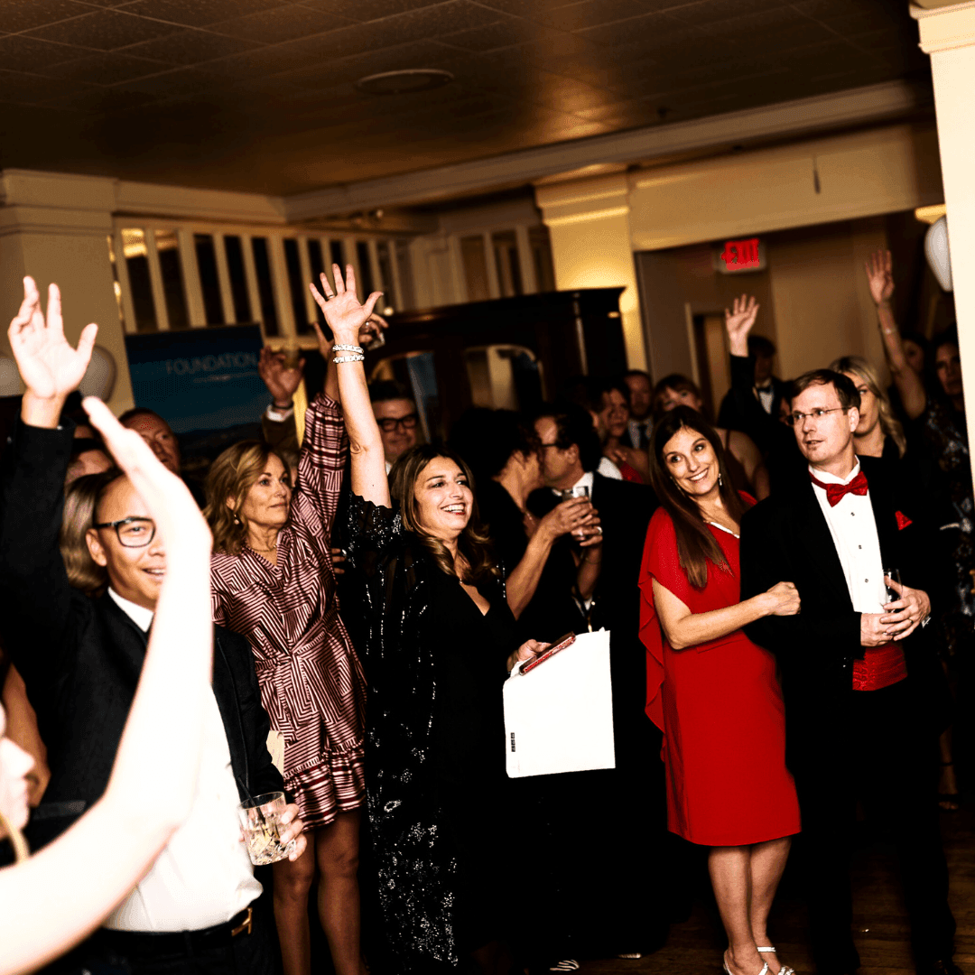 Group of people dancing at an indoor event in Hotel Eldorado