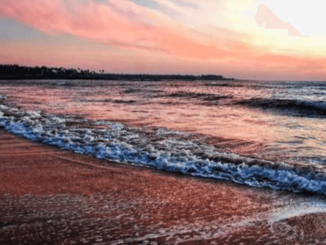 Landscape view of the beach at sunset near Eastin Resort and spa Dapoli