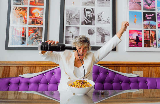 Woman enjoying a cereal bowl in Chilled Cork Restaurant & Lounge at Retro Suites Hotel