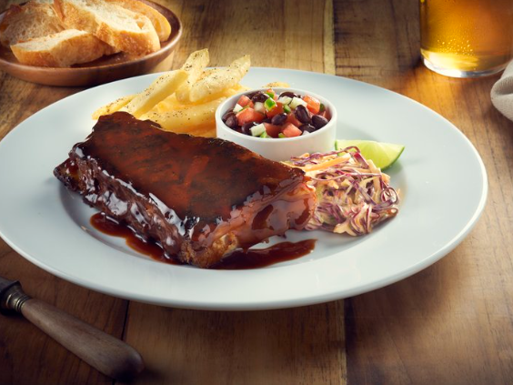 Pork ribs with french fries served at One Hotels