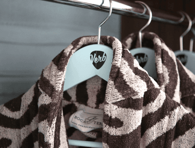 Close-up of two zebra print bathrobes in a guestroom at The Verb Hotel