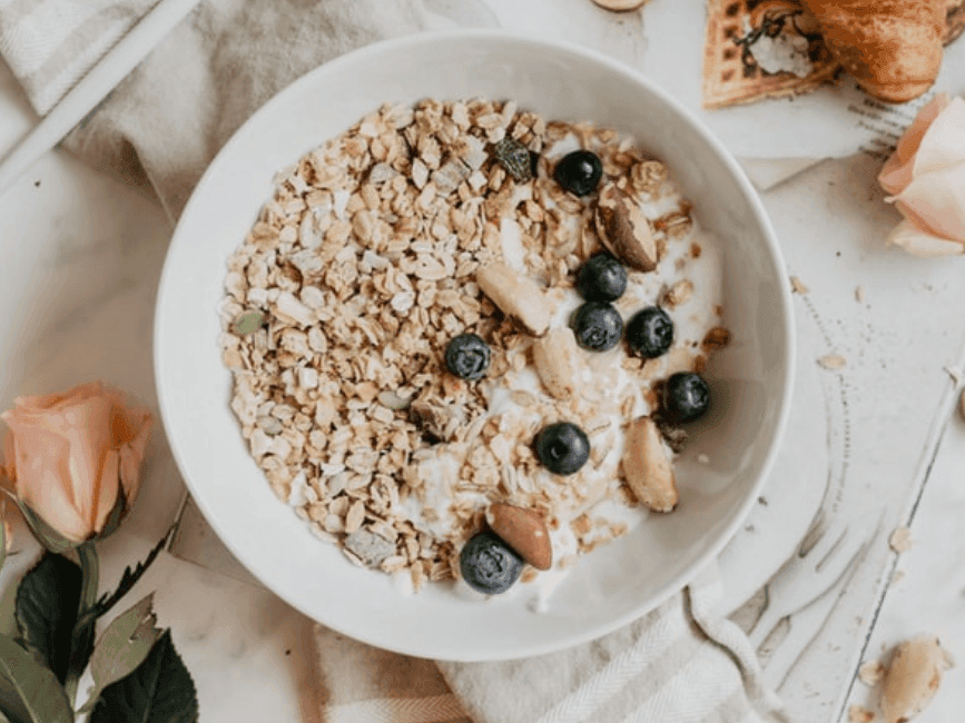 Oats, blue berries breakfast bowl, rose served at Amora Hotel
