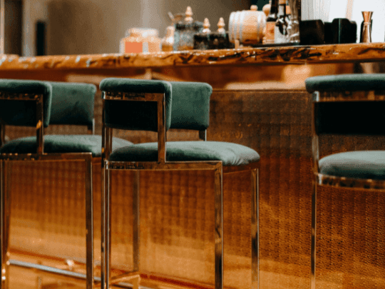 Bar counter area with high stools in Melrose Bar and Louge at Paramount Hotel Midtown