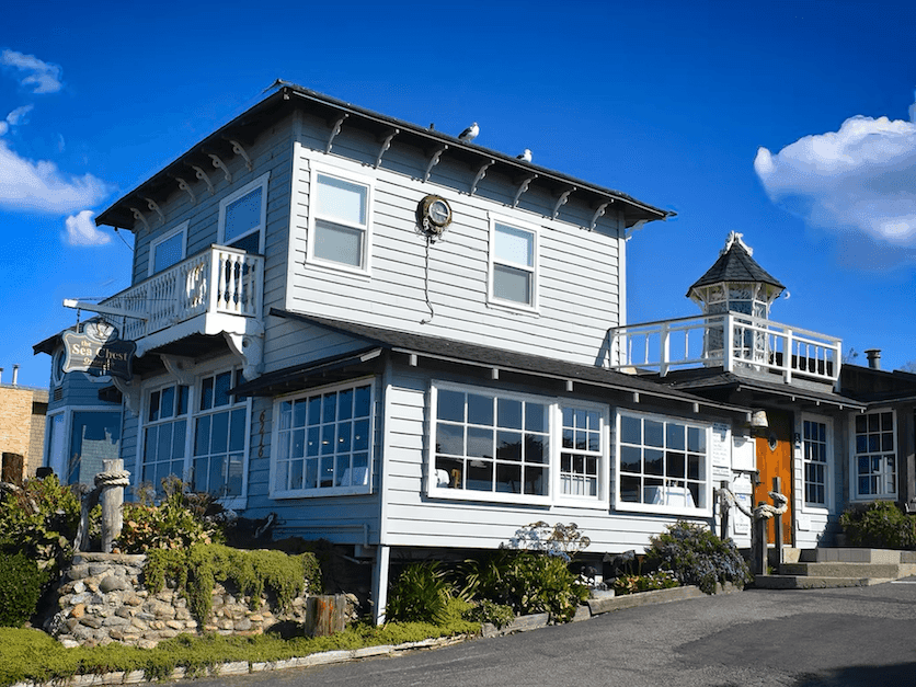 Sea Chest Oyster Bar & Restaurant surrounded by a paved parking area at Sea Otter Inn