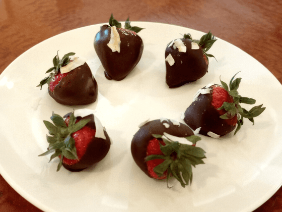 Close-up of chocolate covered strawberries on a plate in the inn at Willow grove