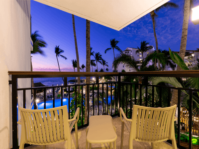 Balcony area with two chairs and table in a room at Buenaventura Grand Hotel and Spa