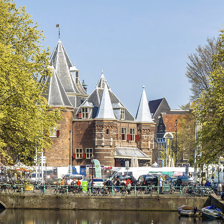 Waag restaurant distance view through the canal near Luxury Suites Amsterdam