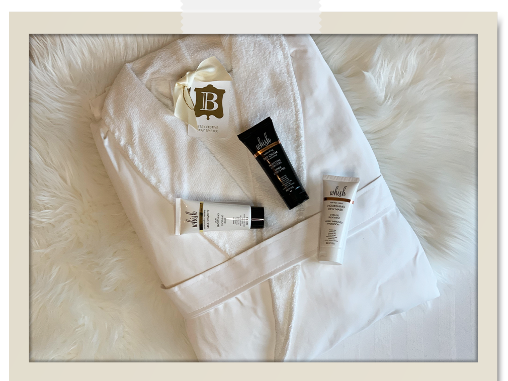 White luxury robe places on fur throw with Whish Products: Hand Remedy; Day Cream; Nourishing Dew Mask
