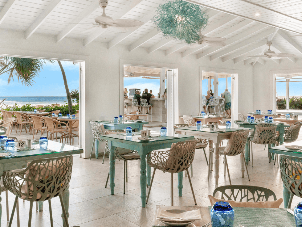 Dining tables arranged in the Reef Restaurant at Sugar Bay Barbados