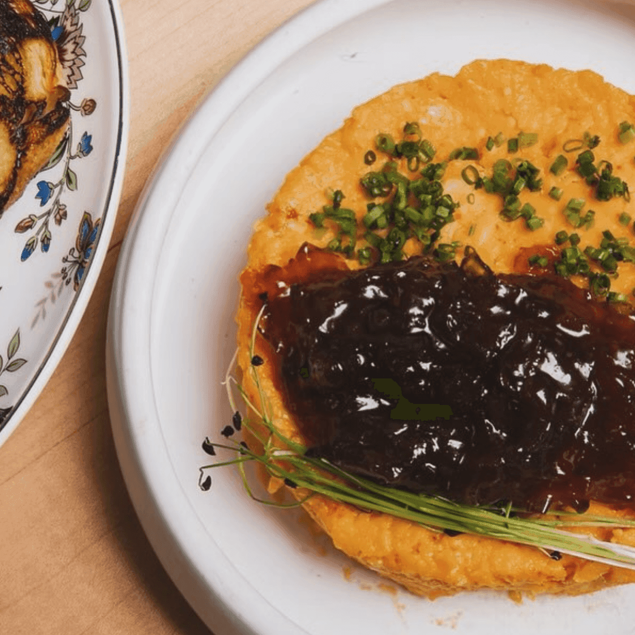 An omlette topped with green onions