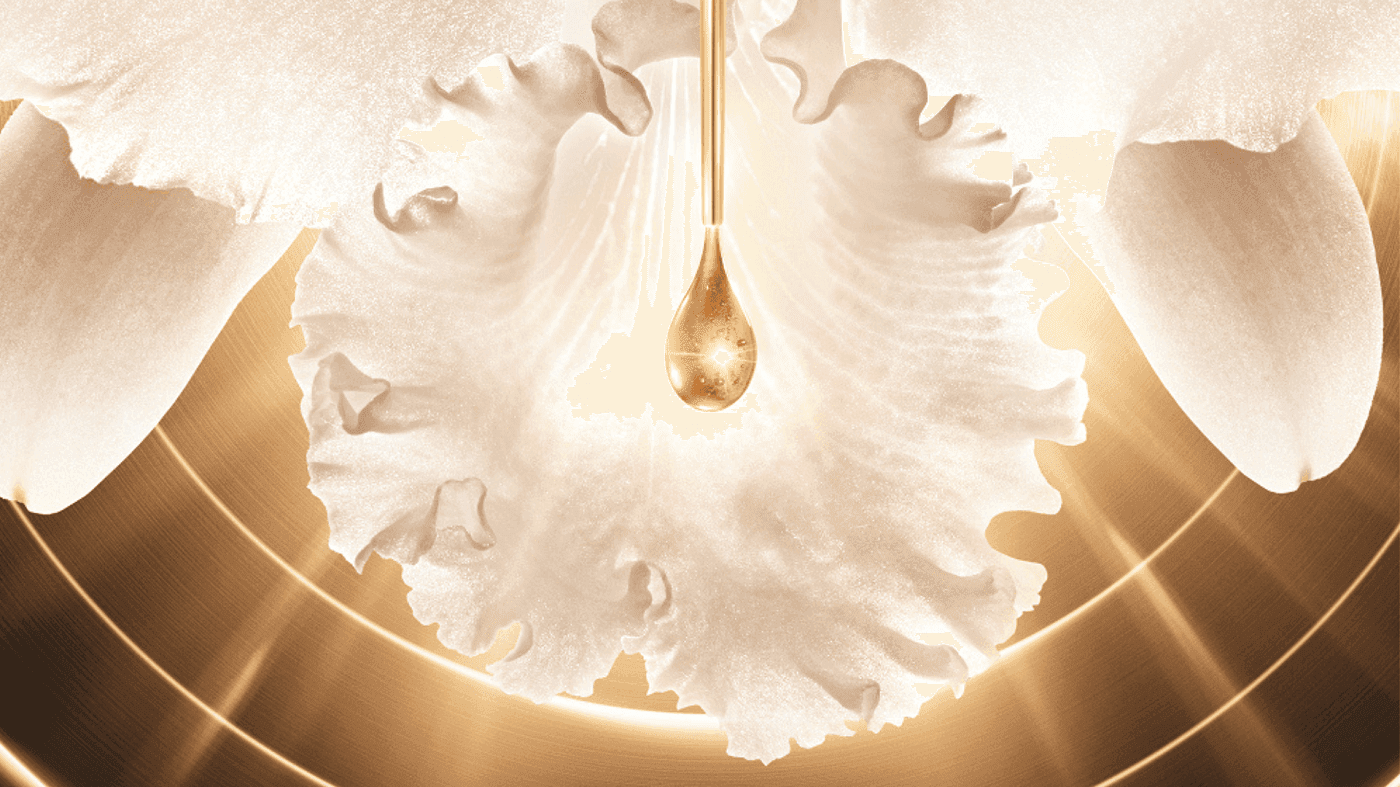 Golden liquid drop falling onto delicate white flower petals for luxury Guerlain spa ad at Hotel X Toronto