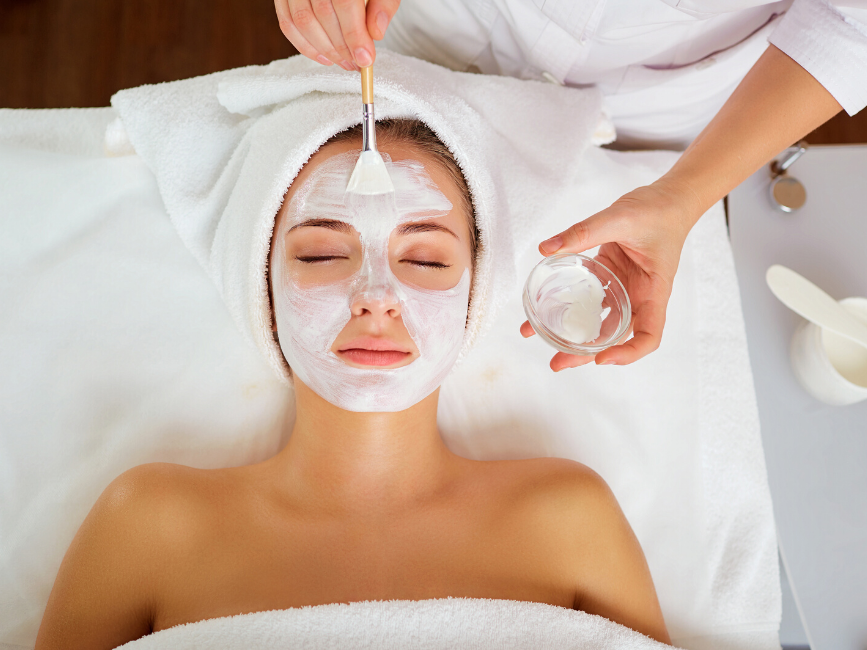 lady having a facial mask treatment at Amora Hotel