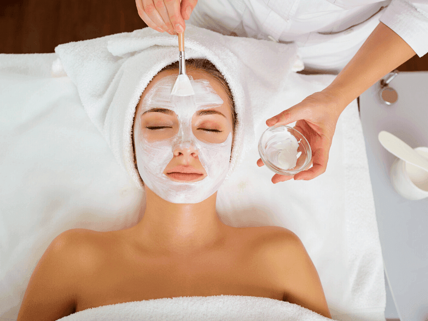 lady having a facial mask treatment at Amora Hotel