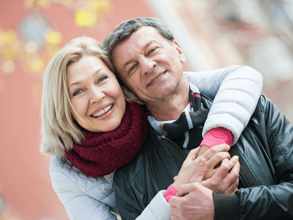 Portrait of happy senior couple snuggling at Hotel Halifax