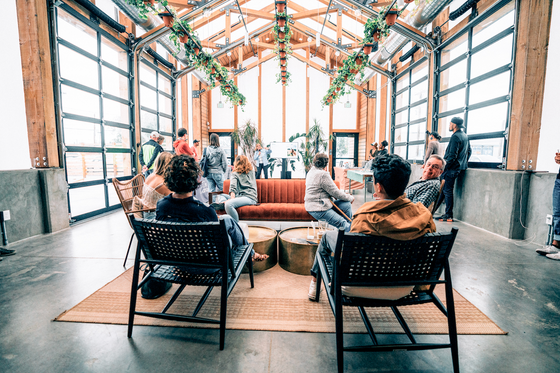 People hanging out in The Greenhaus at Kinship Landing