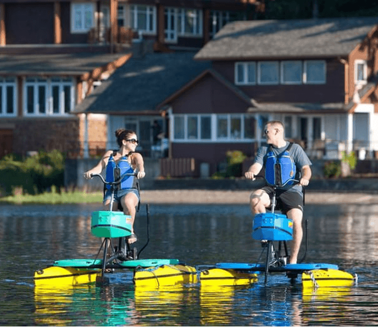 Couple enjoying the hydro bike experience on the lake near Alderbrook Resort & Spa