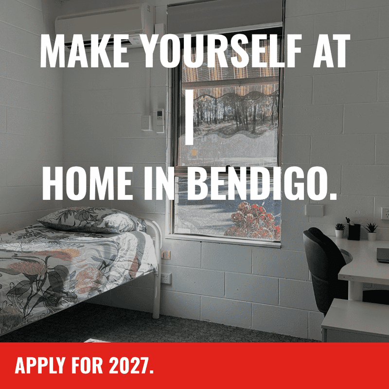 Simple student bedroom with single bed, desk, chair, and window overlooking campus at La Trobe University Orde House