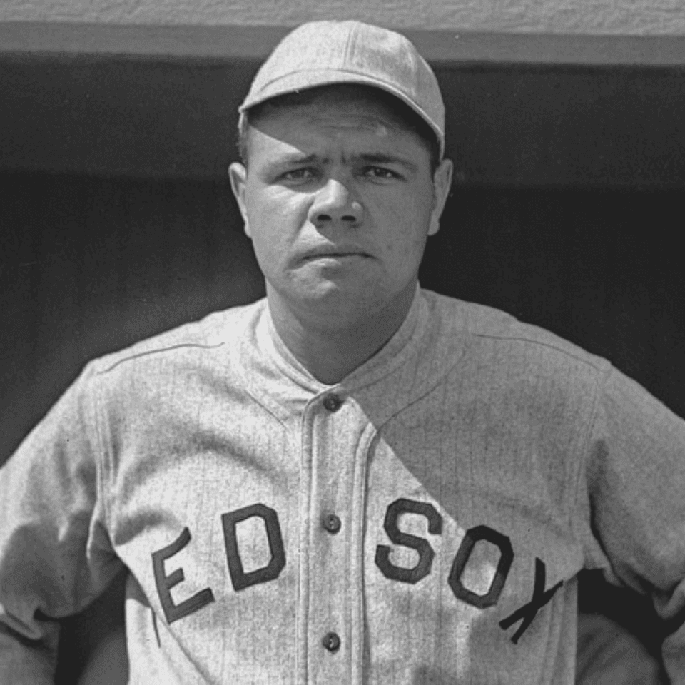 Black and white photo of baseball player Babe Ruth in a Red Sox uniform, displayed at Arlington Resort Hotel & Spa