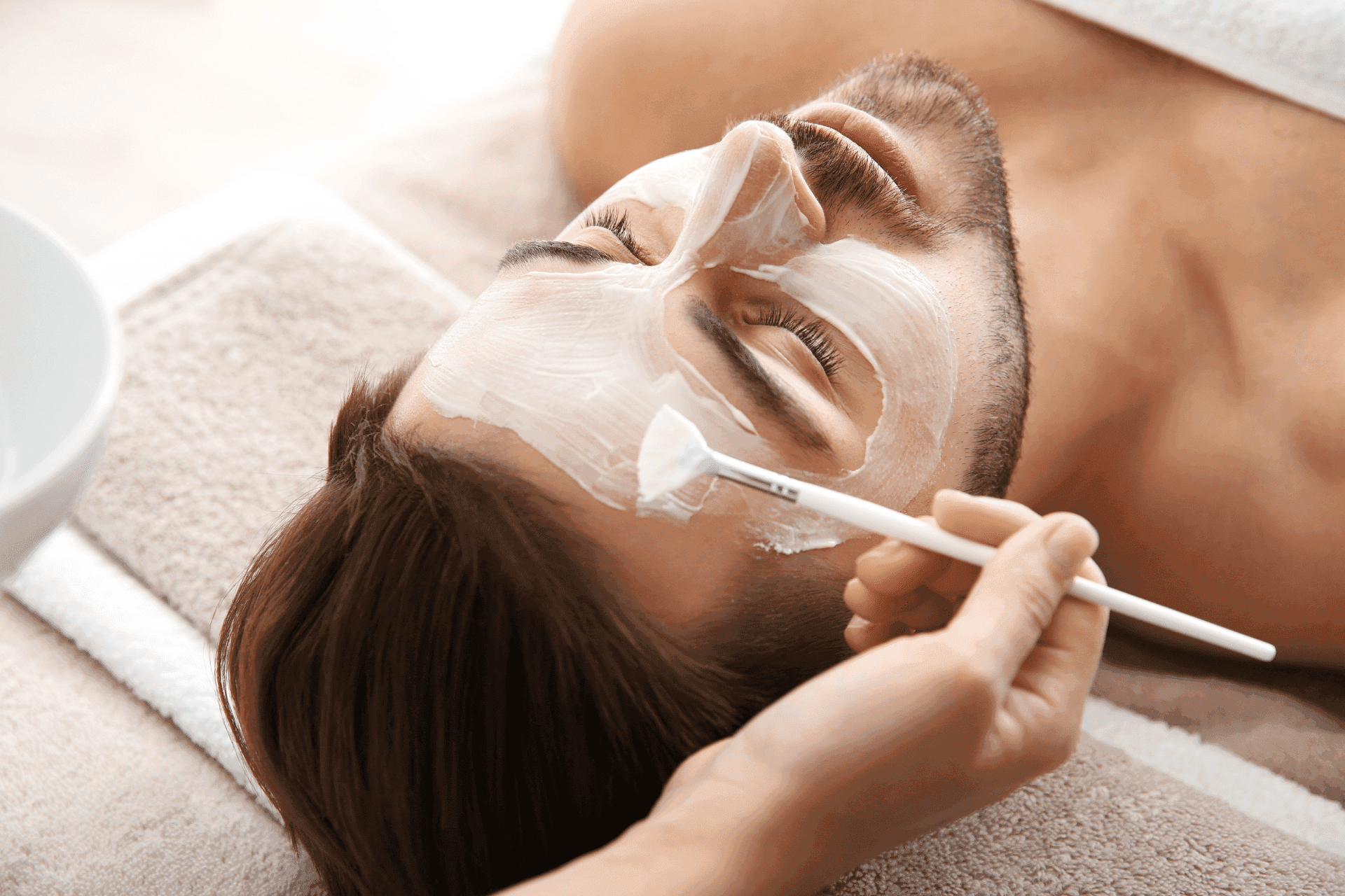 Close-up of a man having a spa beauty facial treatment at Warwick Le Crystal