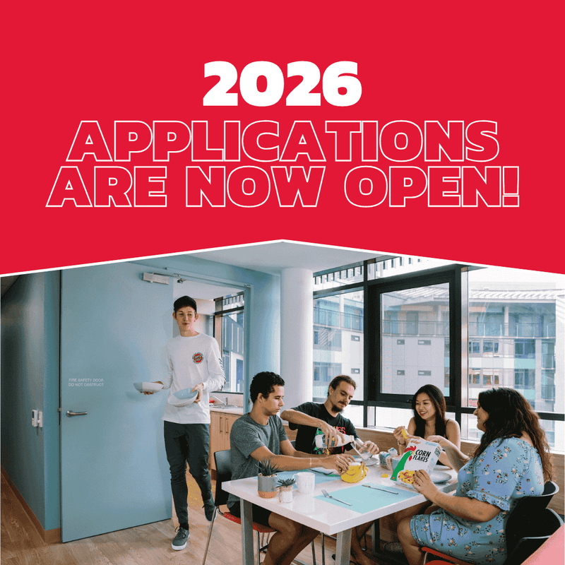 Poster for 2026 applications with people at a table and a man by the door.