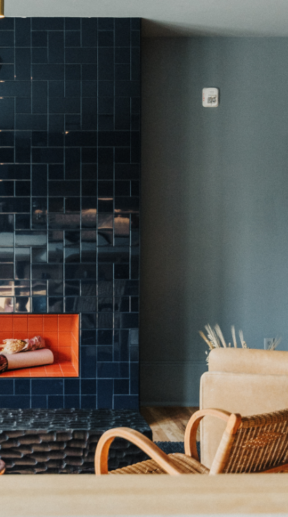 A big meeting room that is well stocked with water and a coffee maker.
