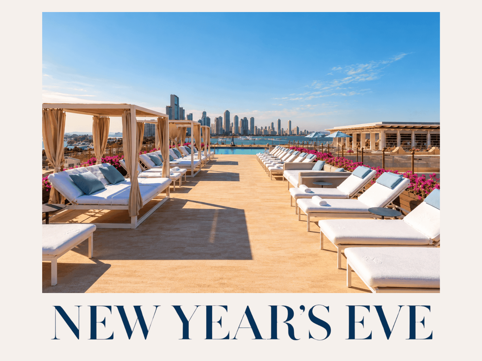 Luxury rooftop terrace at Charleston Santa Teresa Cartagena featuring elegant cabanas, white sun loungers, tropical flowers, and panoramic views of Cartagena's skyline.